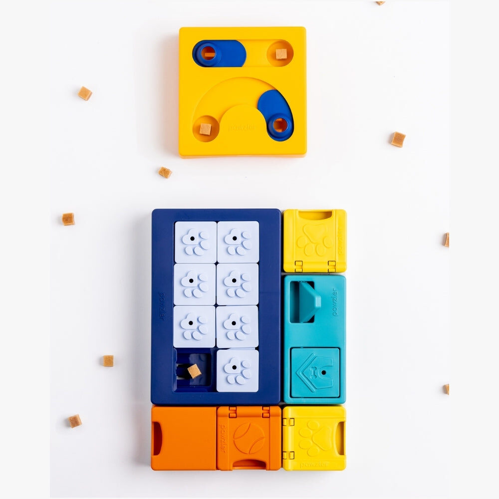 Puzzelstukken van de Pawzler Smarty Set met hondensnoepjes